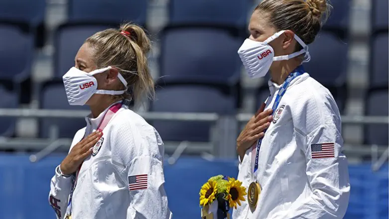 Gold medallists April Ross and Alix Klineman of the United States, during the ceremony