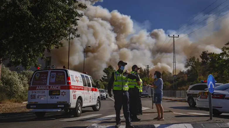 Firefighting teams work to battle enormous forest fire