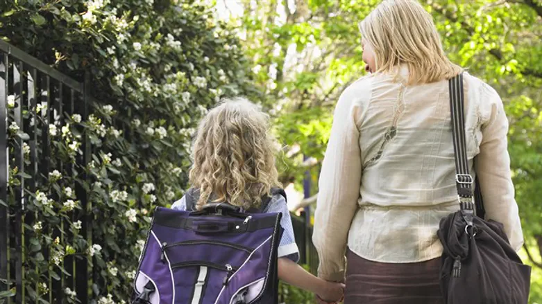 Mother and daughter on their way to school