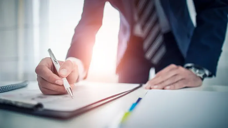 Employee signing document (stock)
