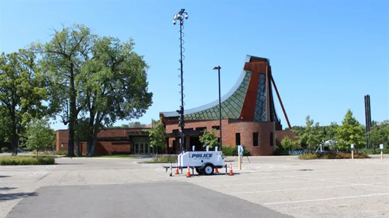 Police set up a camera rig at Beth El Synagogue in St. Louis Park, Minn., Sept. 