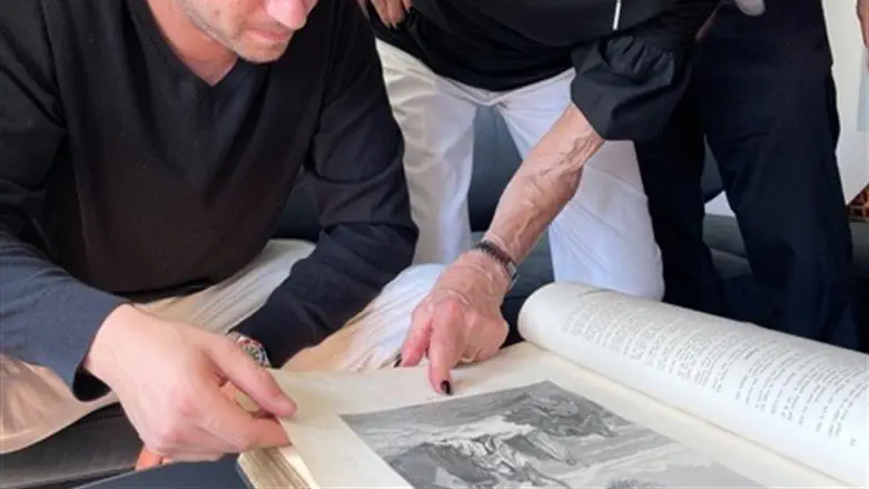 Jacob Leiter and his grandmother, Susi Kasper Leiter, examine an heirloom Bible