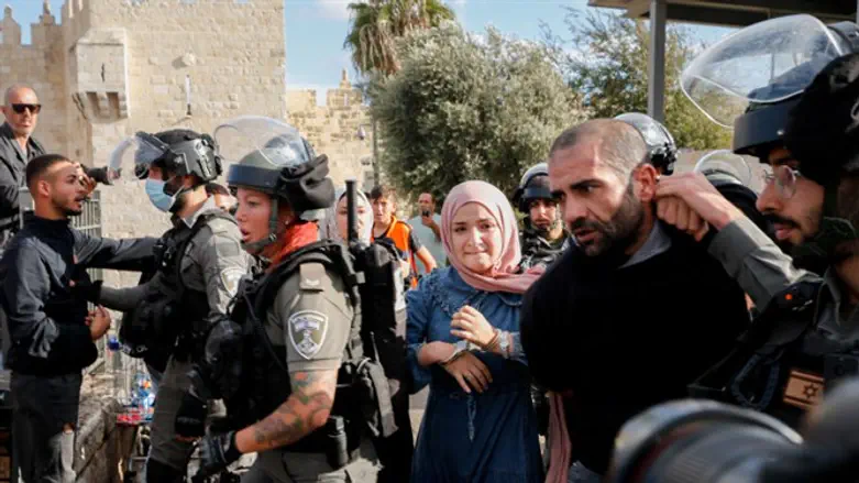 Arab rioters clash with police outside of the Old City of Jerusalem