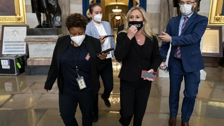 Rep. Marjorie Taylor Greene wears a protective mask reading "Censored" at the U.