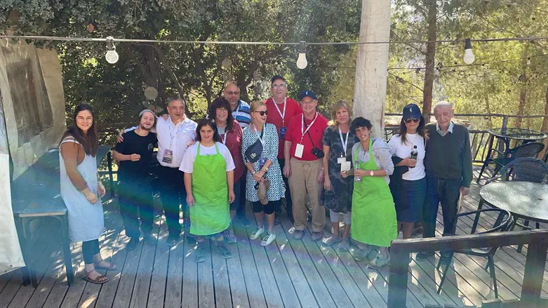 Workers at a cafe in a village called Sadnat Shiluv, which is a town set up for 