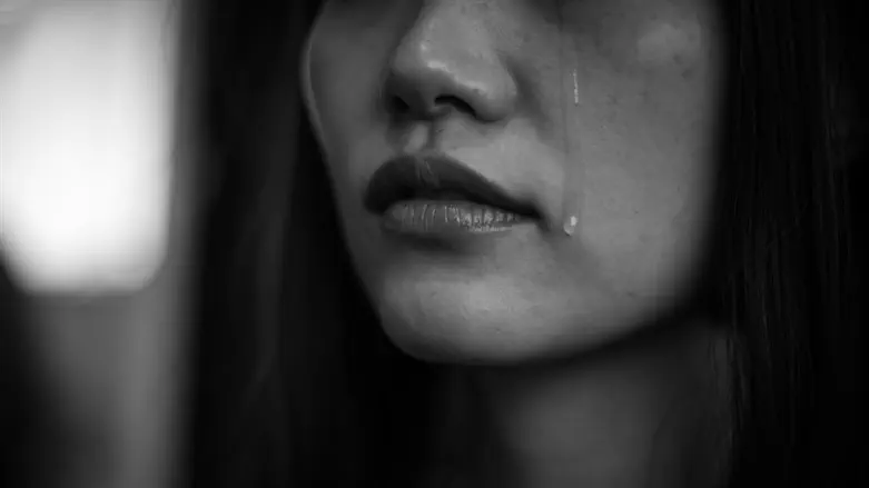 Woman shedding tears