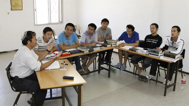 Chinese men studying Torah in Yeshivat Mivtar, preparing for orthodox conversion
