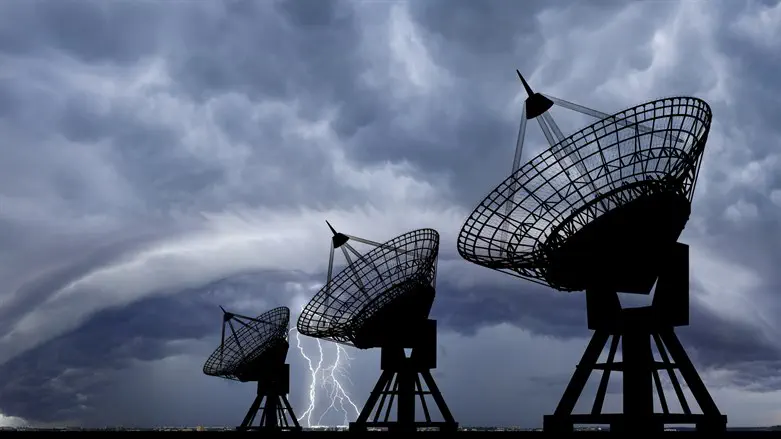 Stormclouds gather over satellite dish array
