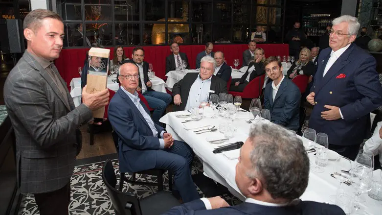 IBC chairman Sinisa Toroman awards the William K. Langfan Award to Aaron Frenkel