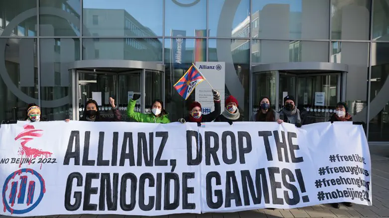 Members of Never Again Right Now protest at Allianz headquarters