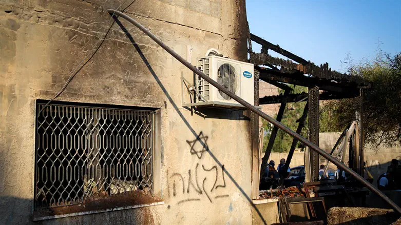 Graffiti at Duma arson site