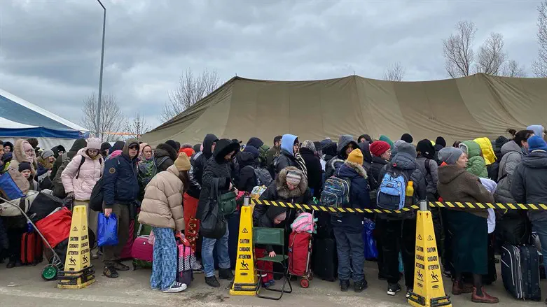 Ukrainians wait to enter the checkpoint at the Ukraine/Moldova border. 