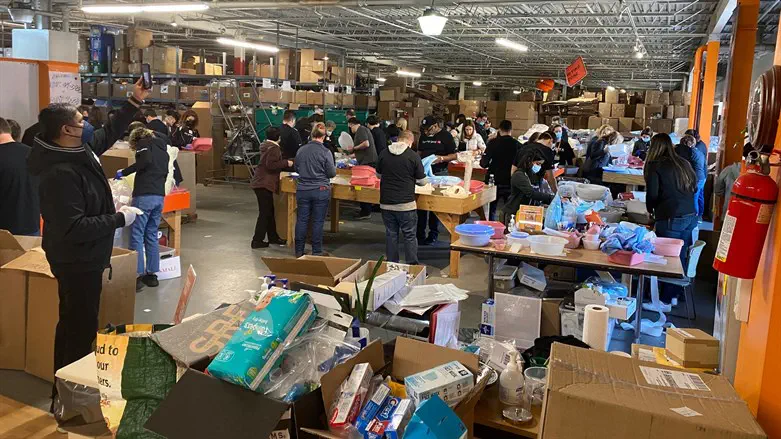 Local rabbis and volunteers load medical supplies, humanitarian aid for refugees