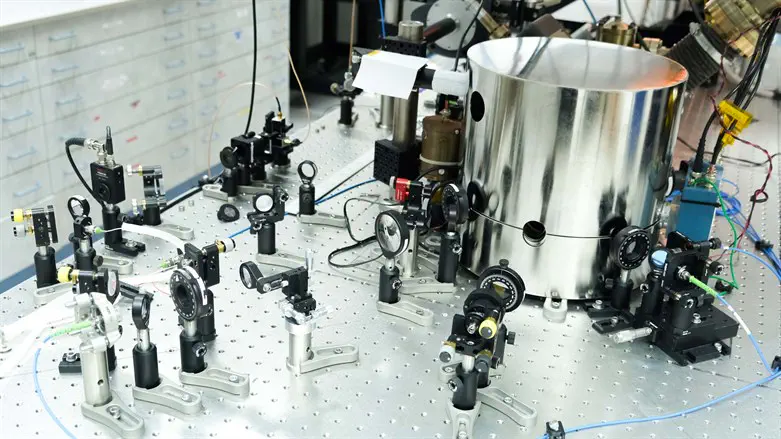 Ion trap in vacuum chamber, placed in metal container to shields them from magnetic noise
