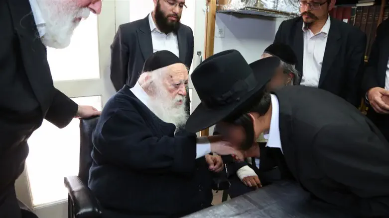 Rabbi Kanievsky blesses a bar mitzvah boy whose mother was rescued by Yad L’Achim