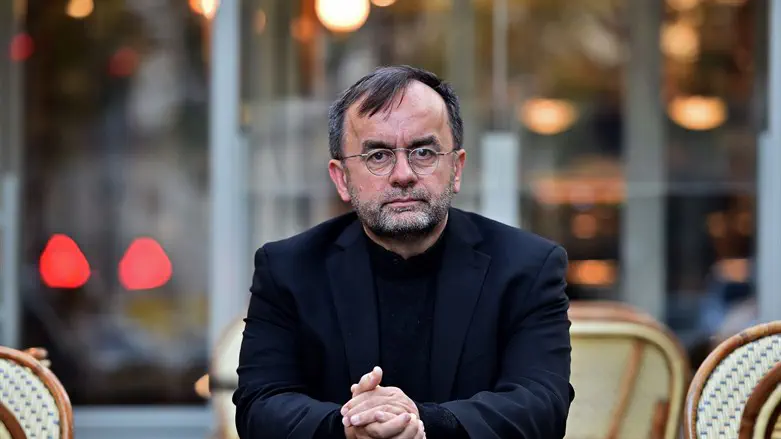 Patrick Desbois sits at a café in Paris, France, Oct. 12, 2016. 