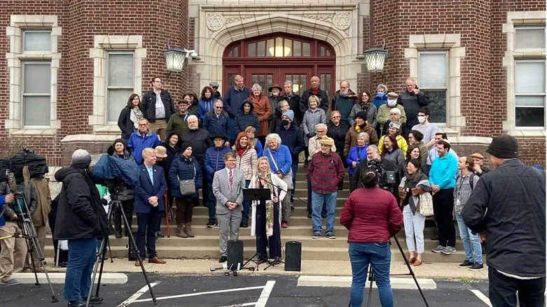 Opponents rally against the restructuring plan