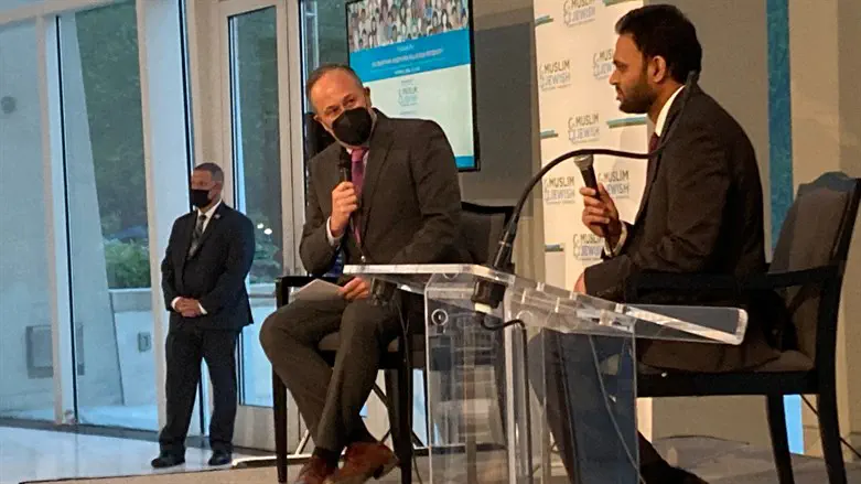 Second Gentleman Douglas Emhoff, left, speaks with Rashad Hussain at a Muslim Je