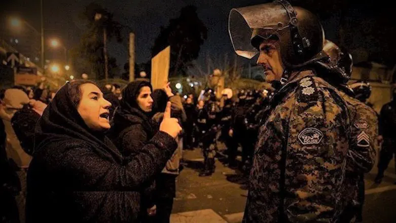 Women facing down soldiers in Tehran protest (Illustrative)