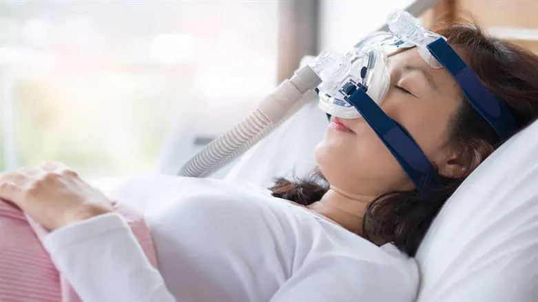 Woman wearing CPAP mask