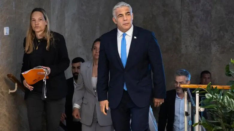 Yair Lapid arrives at cabinet meeting on May 22, 2022