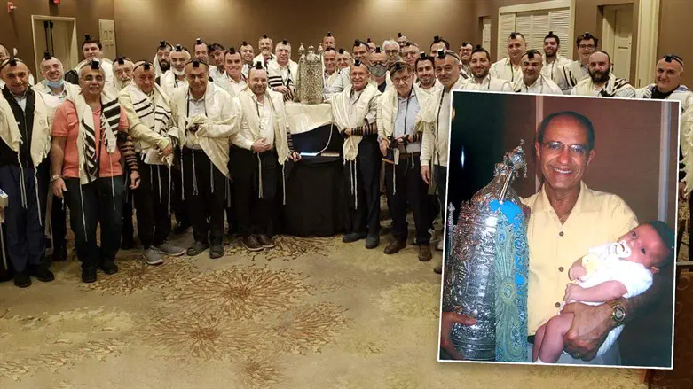 Jack Abraham with his family Torah, which has been used by Jews around the world.