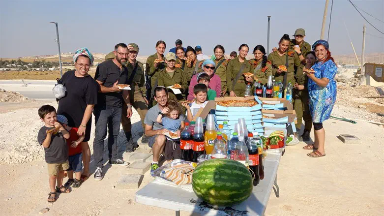 Nokdim residents with their makeshift stand