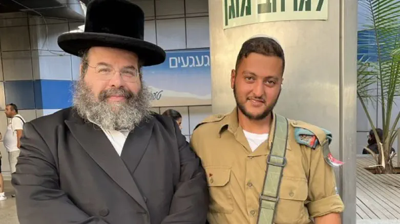 Posing with a soldier at the airport