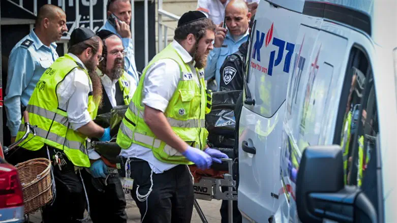 Emergency teams evacuate body of Shulamit Rachel Ovadia, victim of Holon terror attack