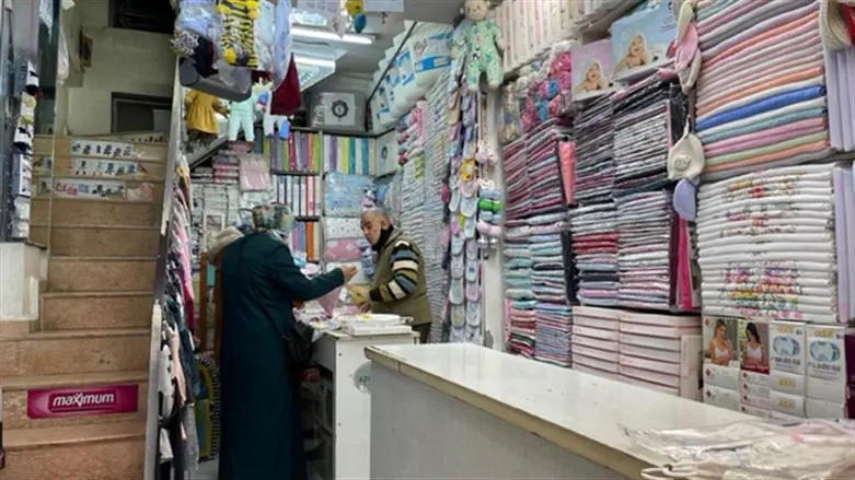 A vendor speaks with a customer in a shop in the city's famed Long Bazaar.