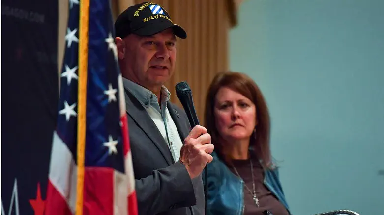 Doug Mastriano speaks as his wife Rebbeca Mastriano looks on
