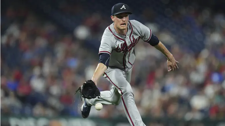 Max Fried of Atlanta Braves flips ball to force out Johan Camargo of Philadelphia Phillies