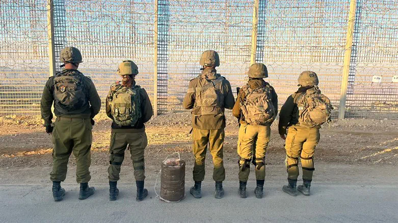 Soldiers with the sack of drugs