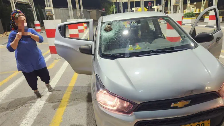 Injured woman next to car that was hit