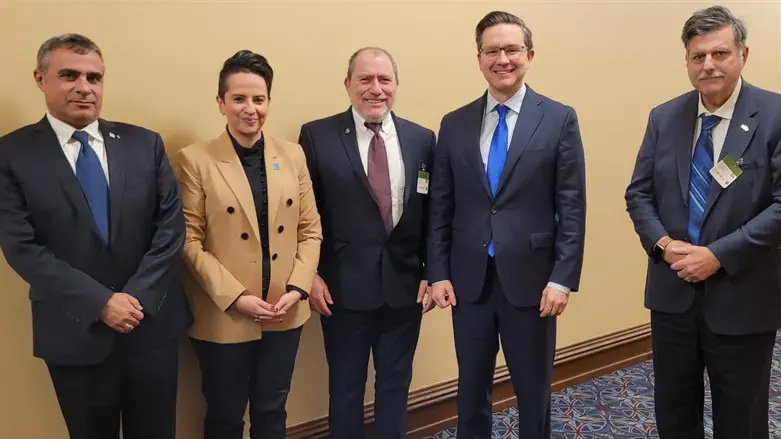 Pierre Poilievre, second from right, during the meeting in Parliament