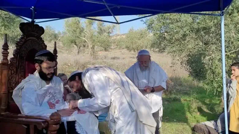 Chaim family carries circumcises their son in Evyatar