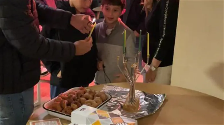 menorah lighting at Belev Echad