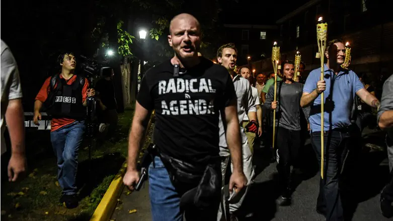 Christopher Cantwell marches with far-right demonstrators in Charlottesville