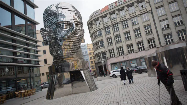 Statue of Franz Kafka by artist David Černý in Prague.