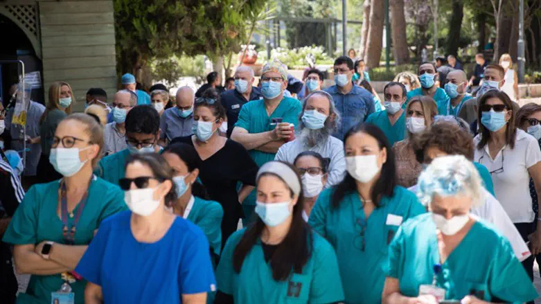 Doctors and nurses strike outside the Hadassah hospital in Jerusalem on August 2