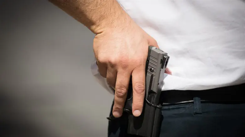 Man carrying pistol