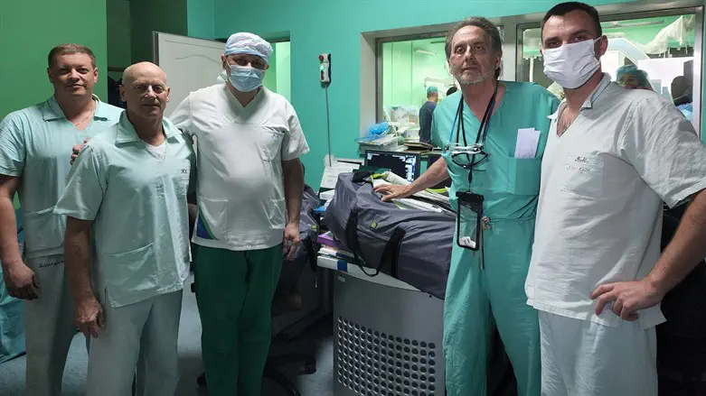 Enrique Ginzburg, second from right, is shown with Ukrainian doctors in Lviv.