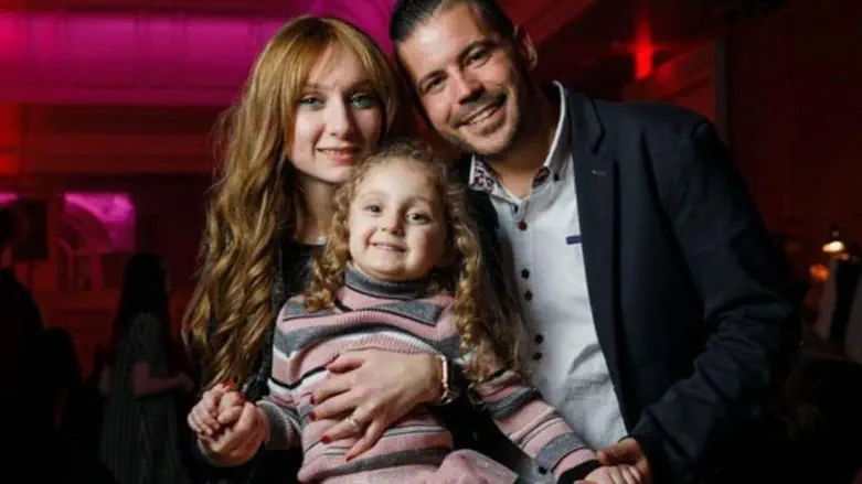 Kalman Goldstein, his wife, and his seven-year-old daughter
