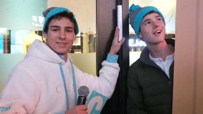 Chabad teen convention in Times Square at mezuzah at American Eagle Outfitters