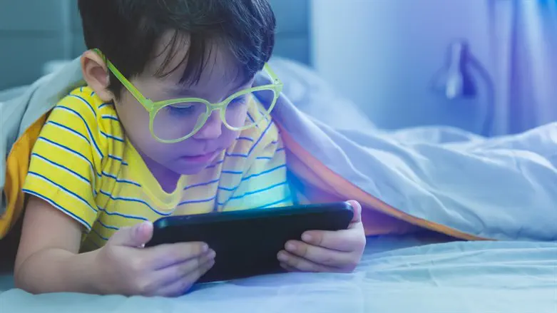 Young child with a cellphone (illustrative)