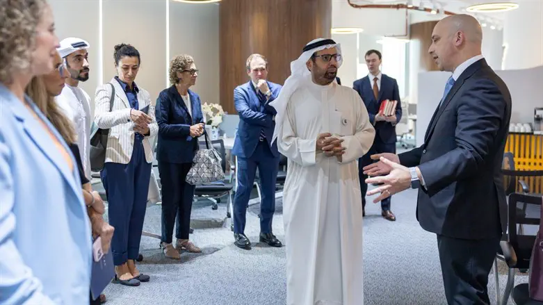 Jonathan Greenblatt, right, confers with Ali Al Naomi