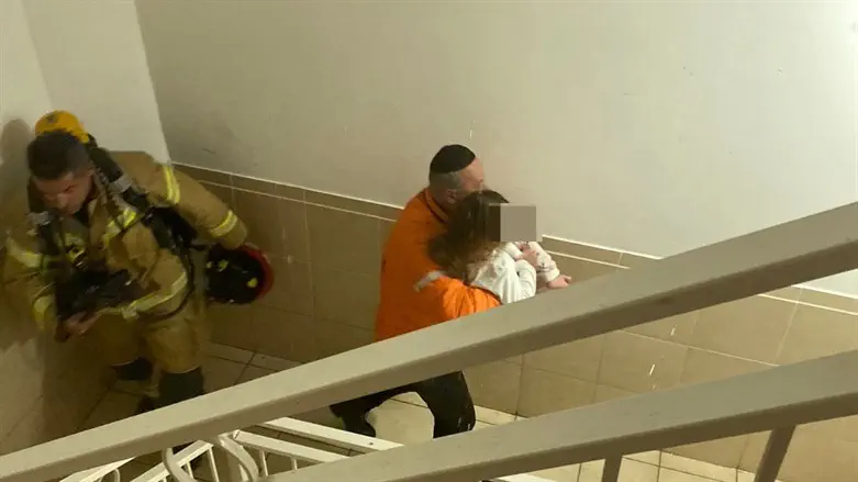 Yechezkel Even carrying a child to safety