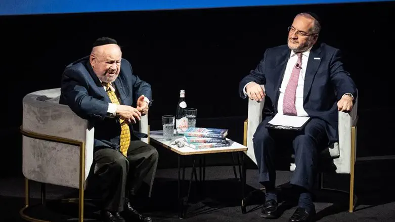 Josef Lewkowicz speaks with Rabbi Naftali Schiff at his book launch in BAFTA