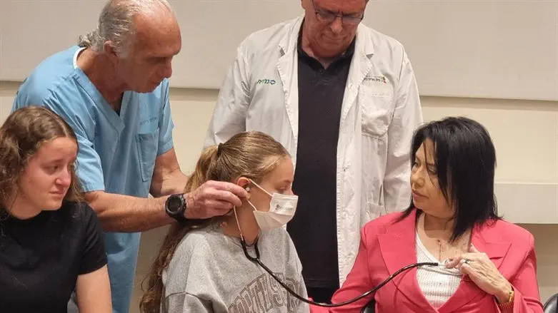 The Dee family listens to Lucy Dee's heart