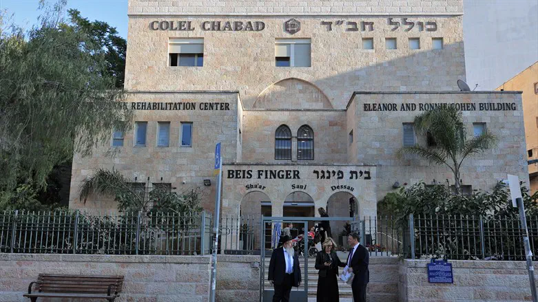 Rabbi Sholom Duchman with Marsha and Michael Lax, outside Beit Finger